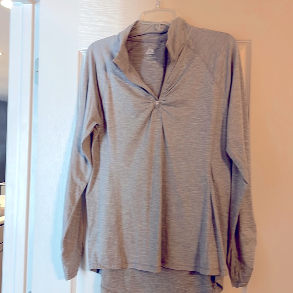 Grey RBX half zip workout shirt.